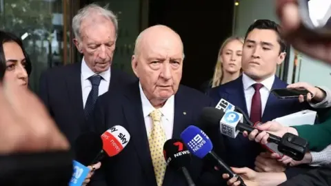 Indecent Assault Charges Involving Prominent Down Under Media Personality Downgraded